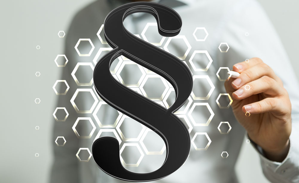 Auf dem Bild sind die Zeichen des Paragraphen erkennbar.